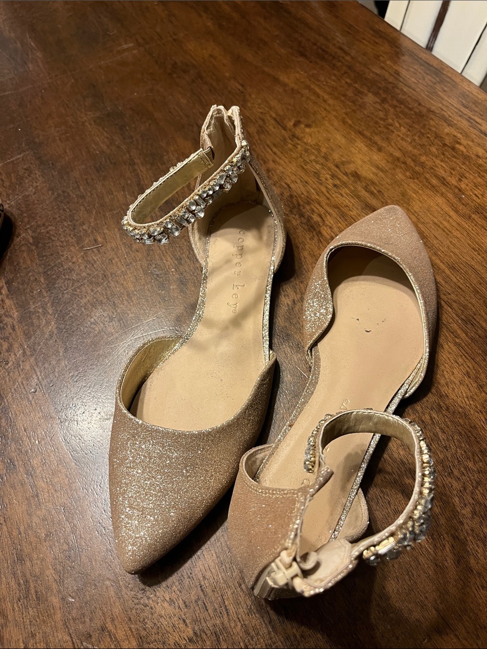 Copper Key Glitter Pointed-Toe Ankle-Strap Flats in Rose